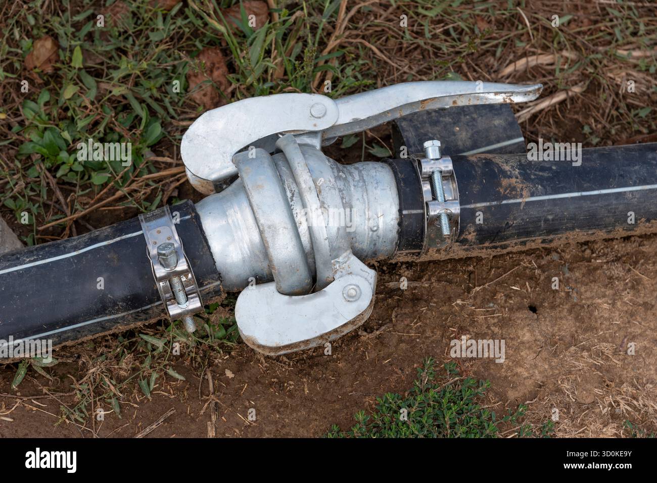 Lasithi plateau, Crete, Greece. 30.09.2023.  Close up of irrigation pipe on fertile land on Lasithi Plateau in eastern Crete, Greece. - Stock Image