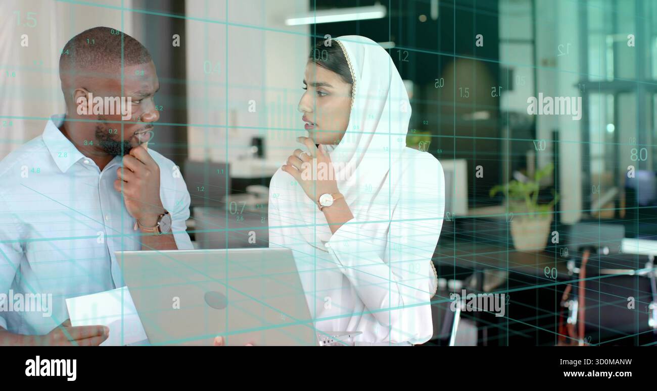 Professionals in professional attire analyzing data on laptop in office, with digital grid overlay Stock Photo
