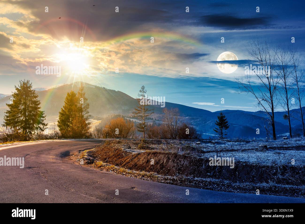 country road in mountains. day and night time change concept. beautiful countryside landscape in late autumn. fir trees on the roadside with sun and m Stock Photo