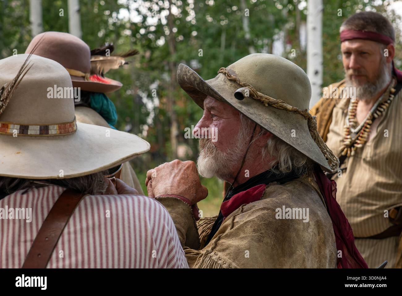 Men in period mountain man dress at the Fort Bridger Rendezvous at the ...
