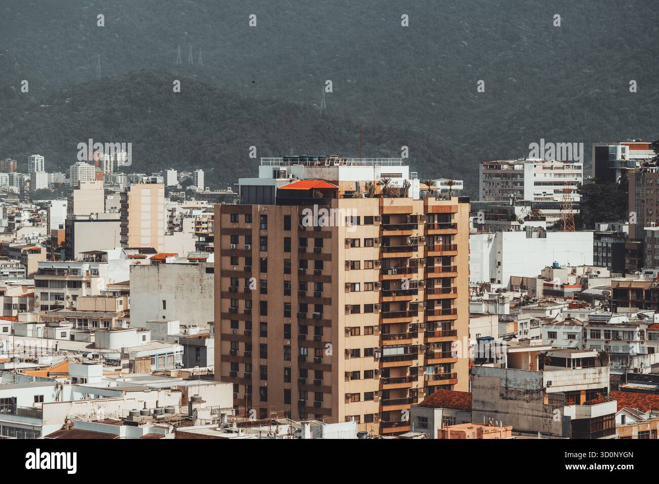 Urban cityscape with tall residential apartment building surrounded by ...