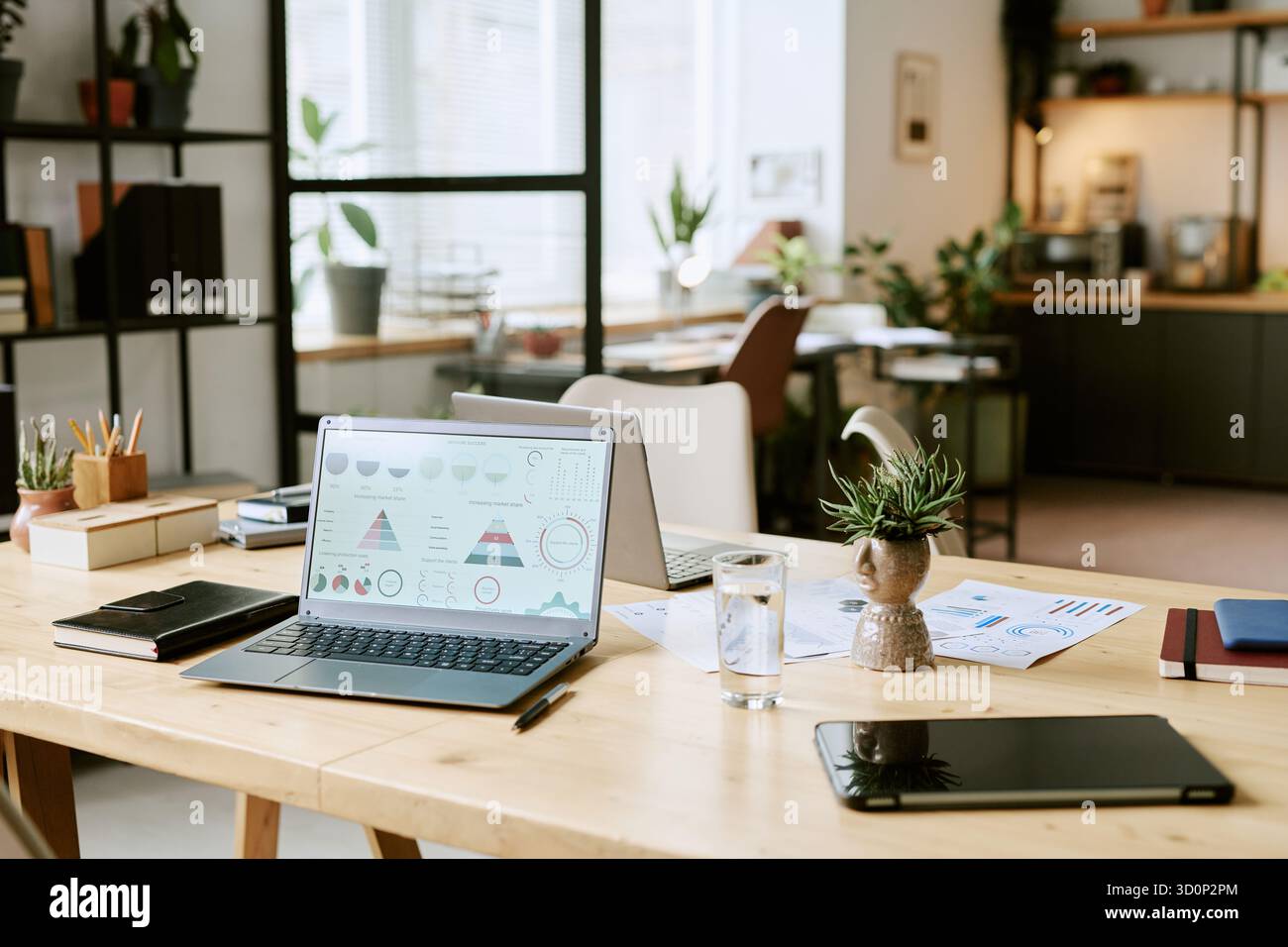 Modern Office Workspace Featuring Laptop Displaying Business Analytics ...