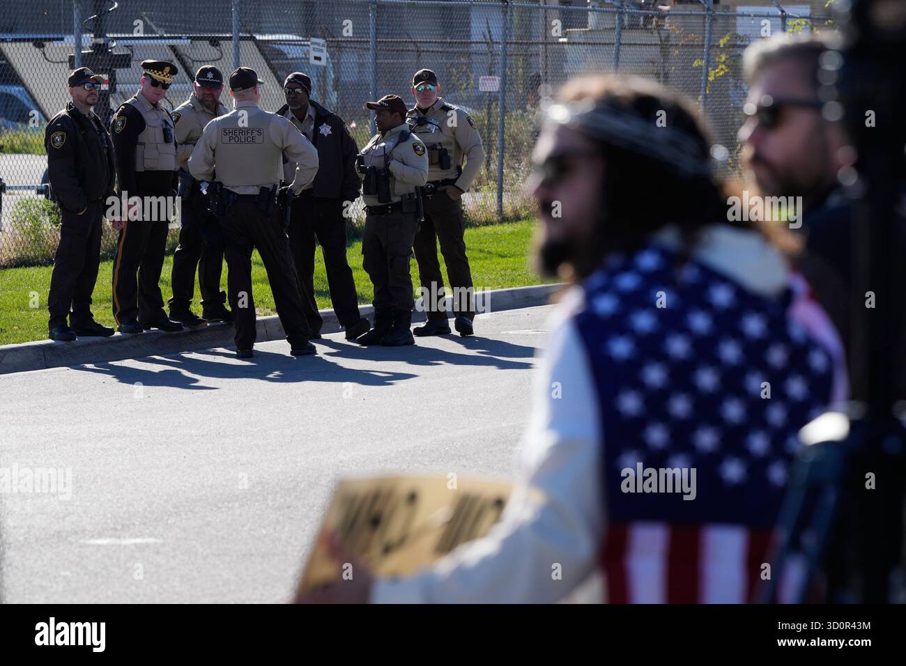 Police guard as protesters gather outside an ICE processing facility in ...