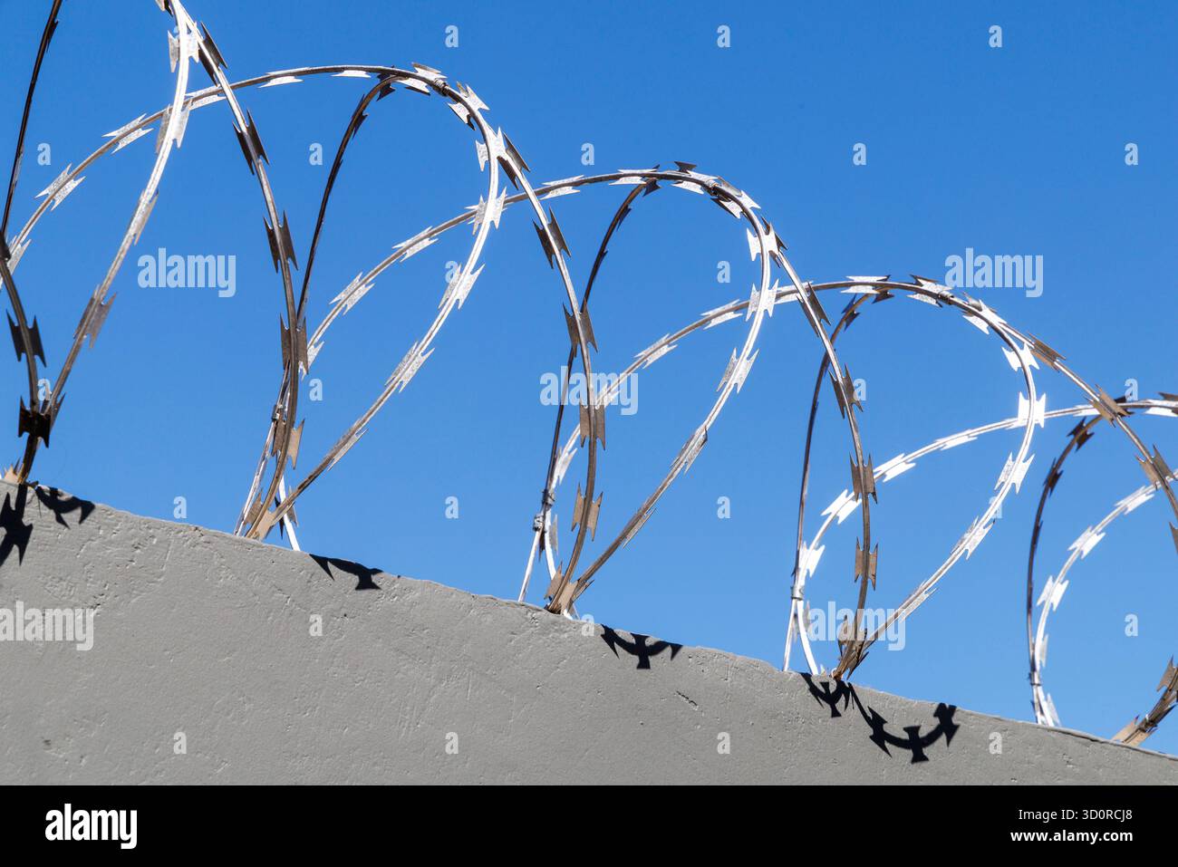Razor wire fence wall hi-res stock photography and images - Alamy
