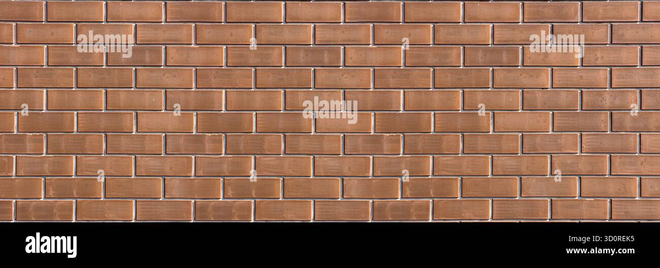 Brick wall surface creating a uniform texture and pattern for backgrounds Stock Photo