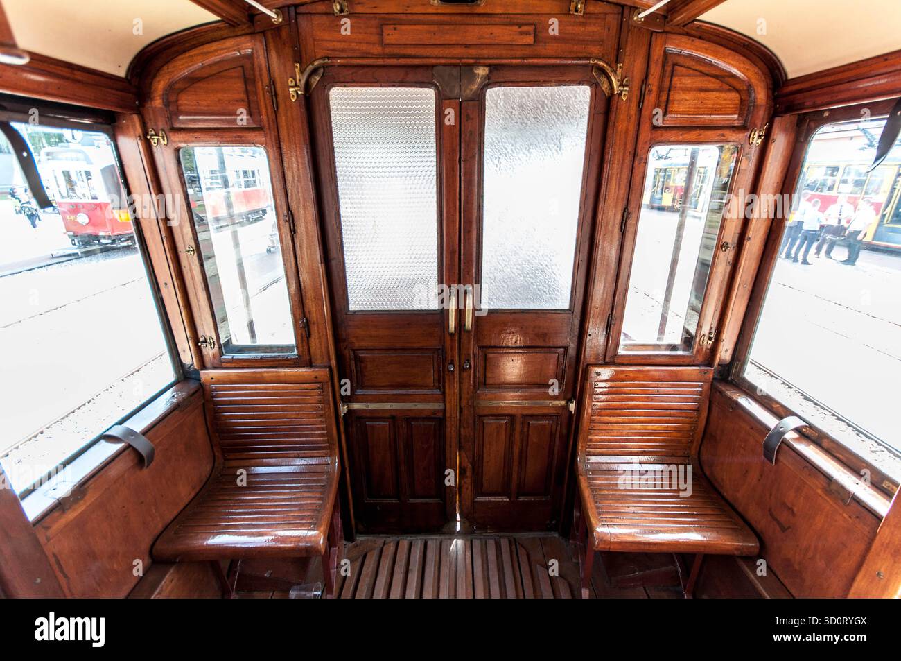 Brown wooden interior of renovated old city tram used for public ...
