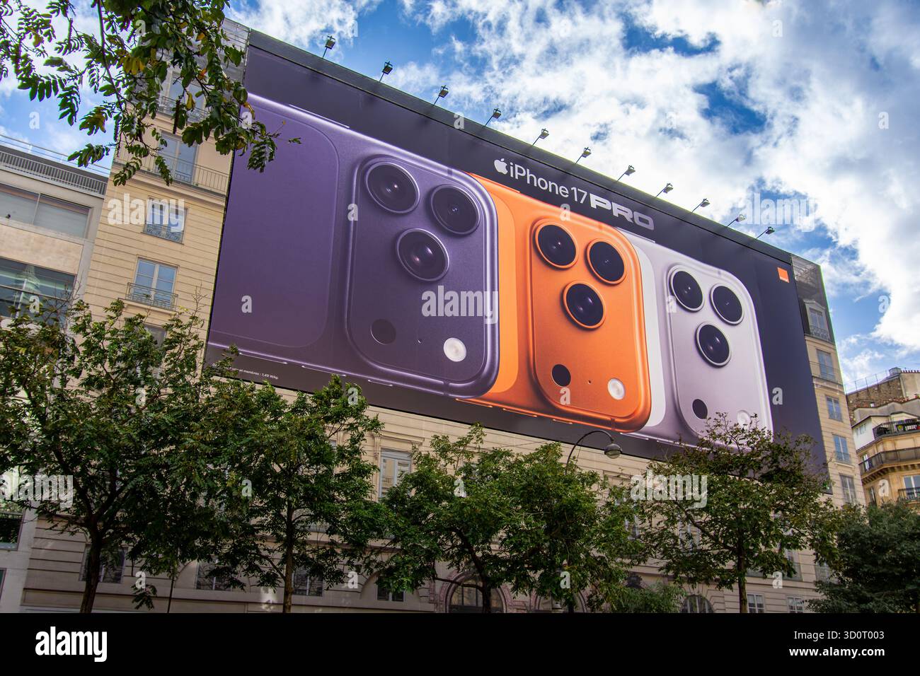 Large advertising billboard for the Apple iPhone 17 Pro smartphone covering the scaffolding of restoration work on the facade of a Parisian building Stock Photo