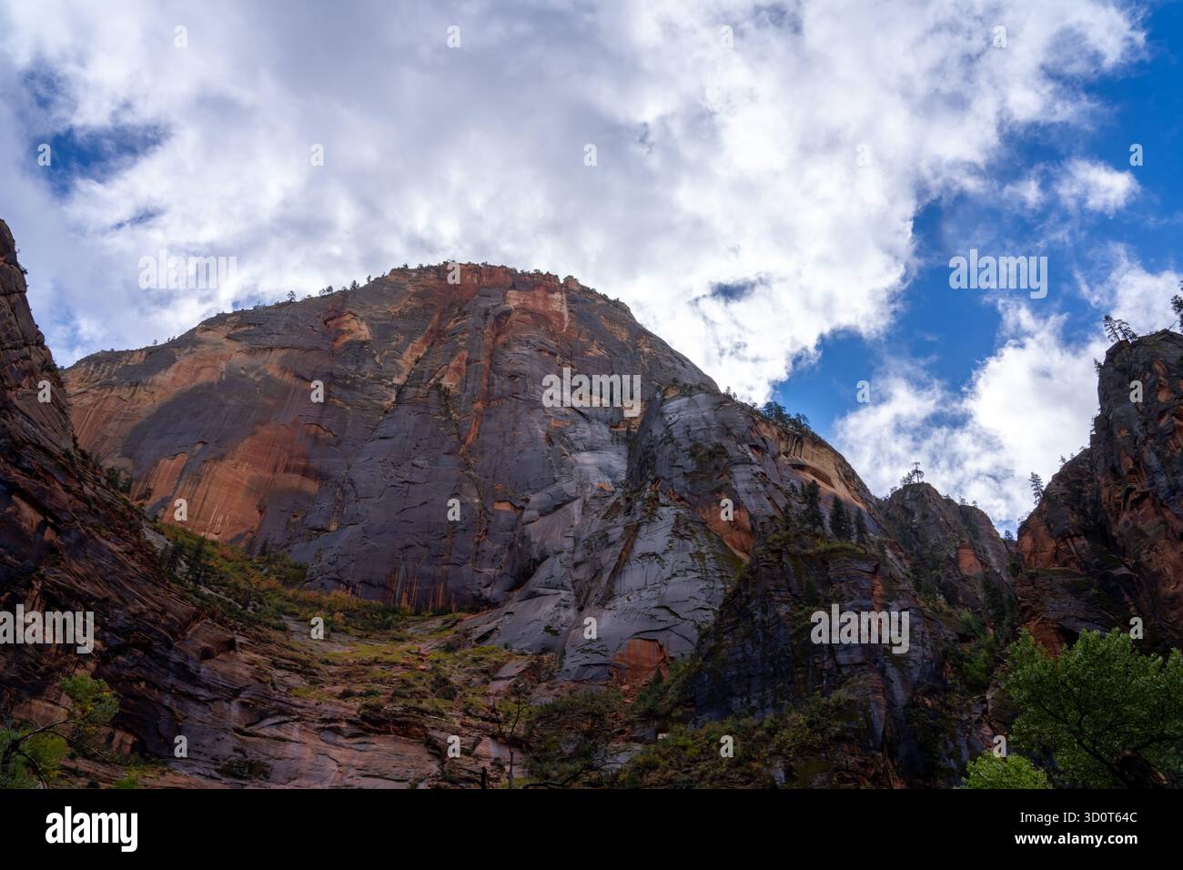A dramatic view of the towering sandstone cliffs of Zion National Park ...
