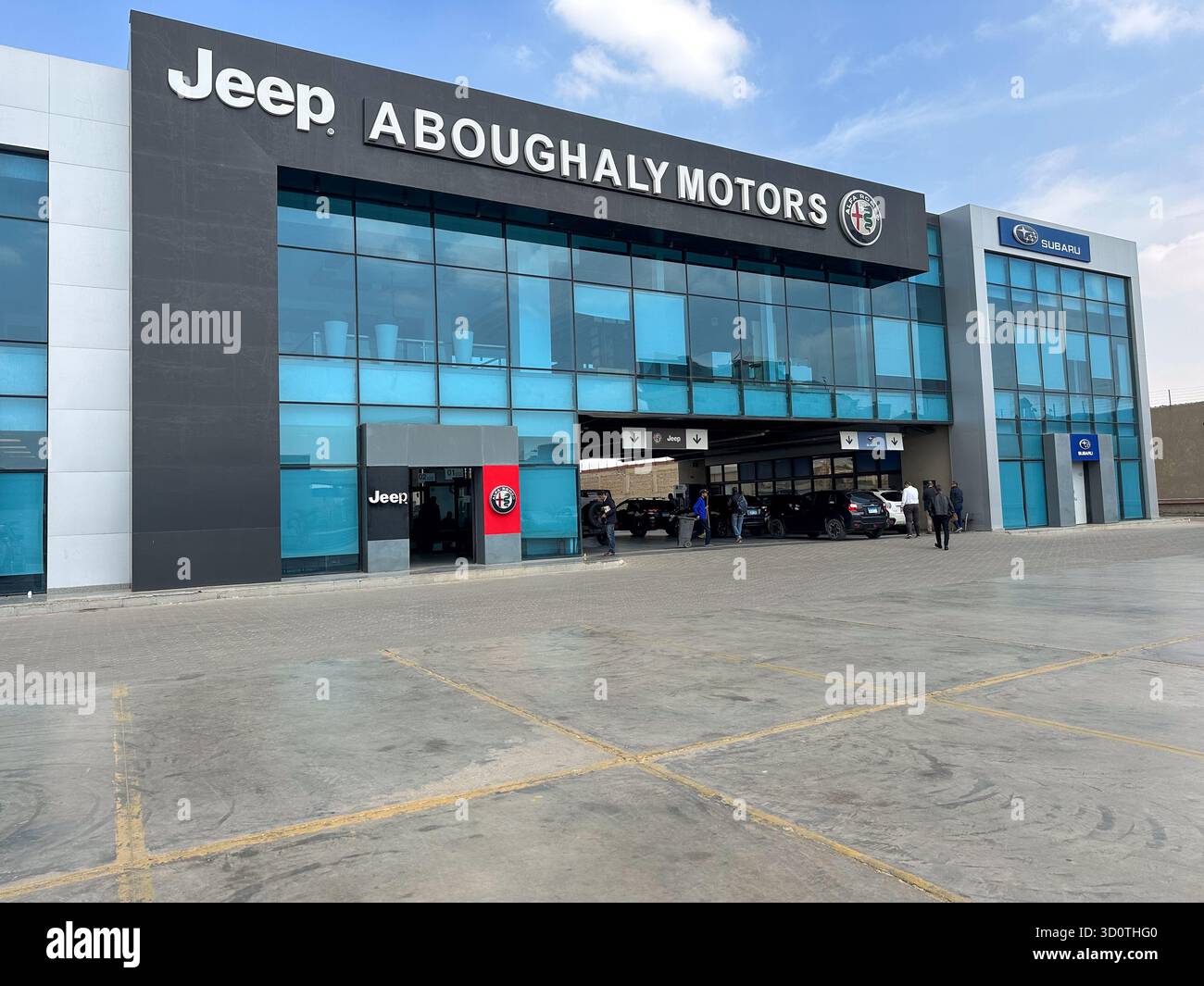 Cairo, Egypt - 21 March 2023: Jeep, Subaru and Alfa Romeo service center and showroom Aboughaly Motors on Ismailia Desert Road - Smartphone Captured Stock Image