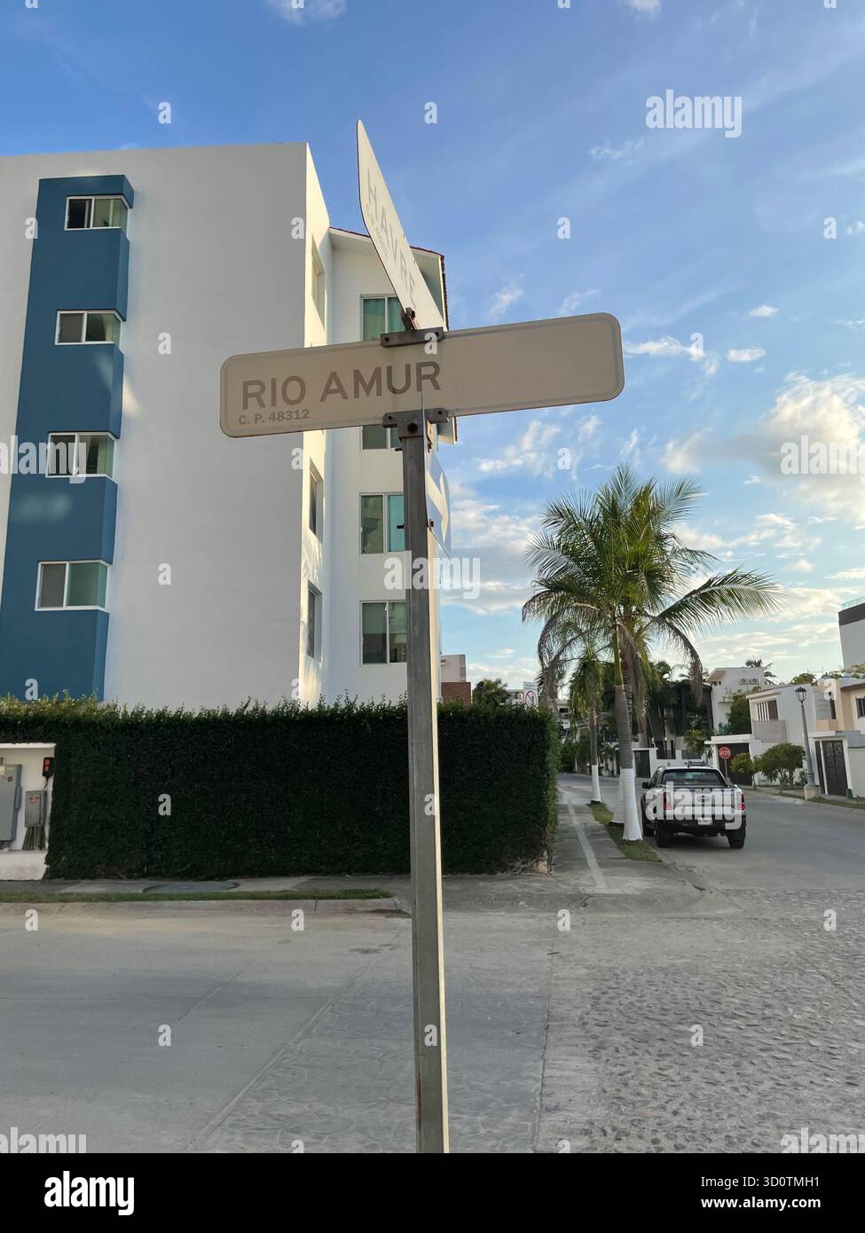 Street Sign 'Rio Amur' in a Modern Tropical Neighborhood at Dusk, Puerto Vallarta, Mexico - Smartphone Captured Stock Image