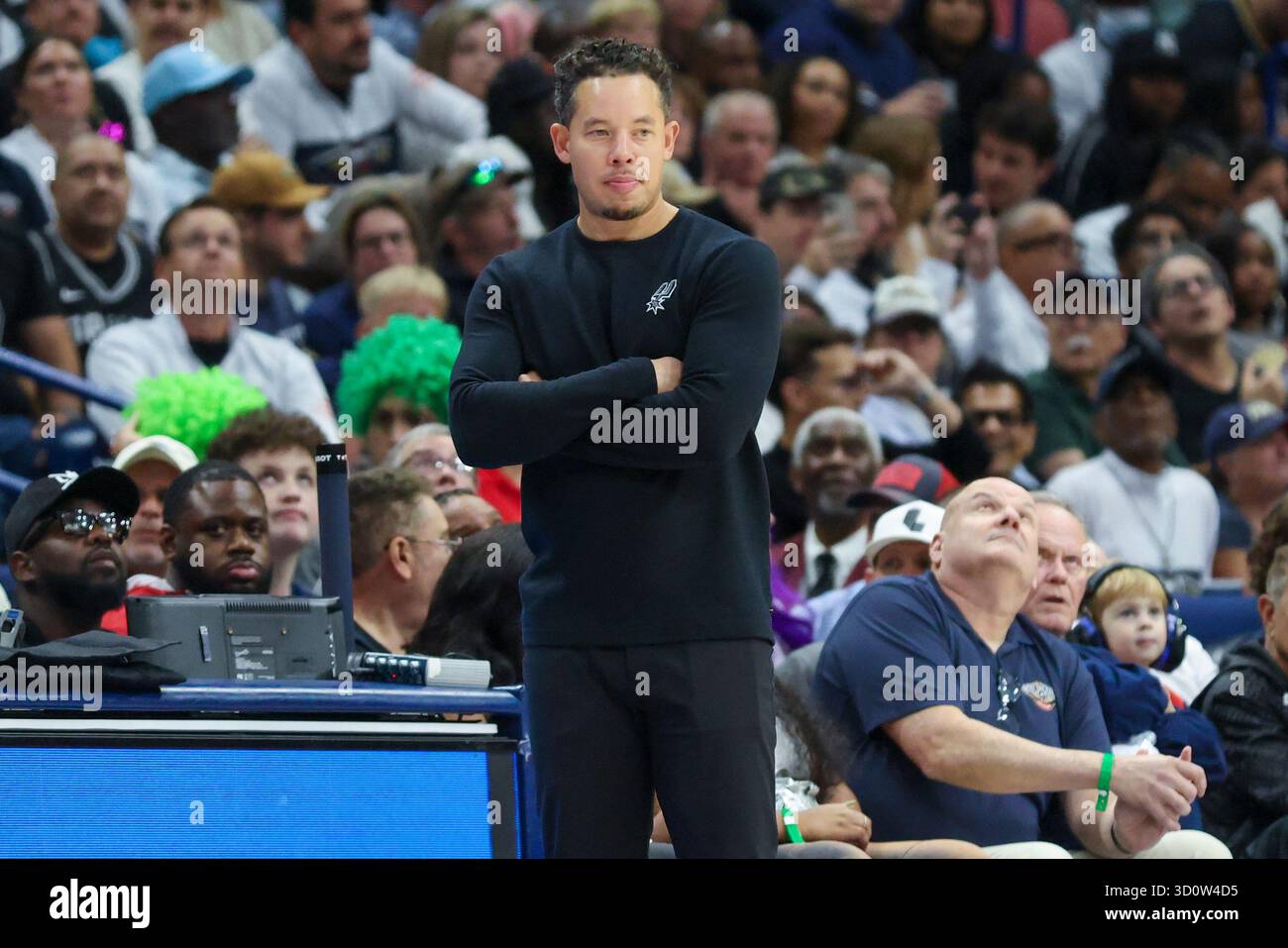 San Antonio Spurs head coach Mitch Johnson watches the action on the