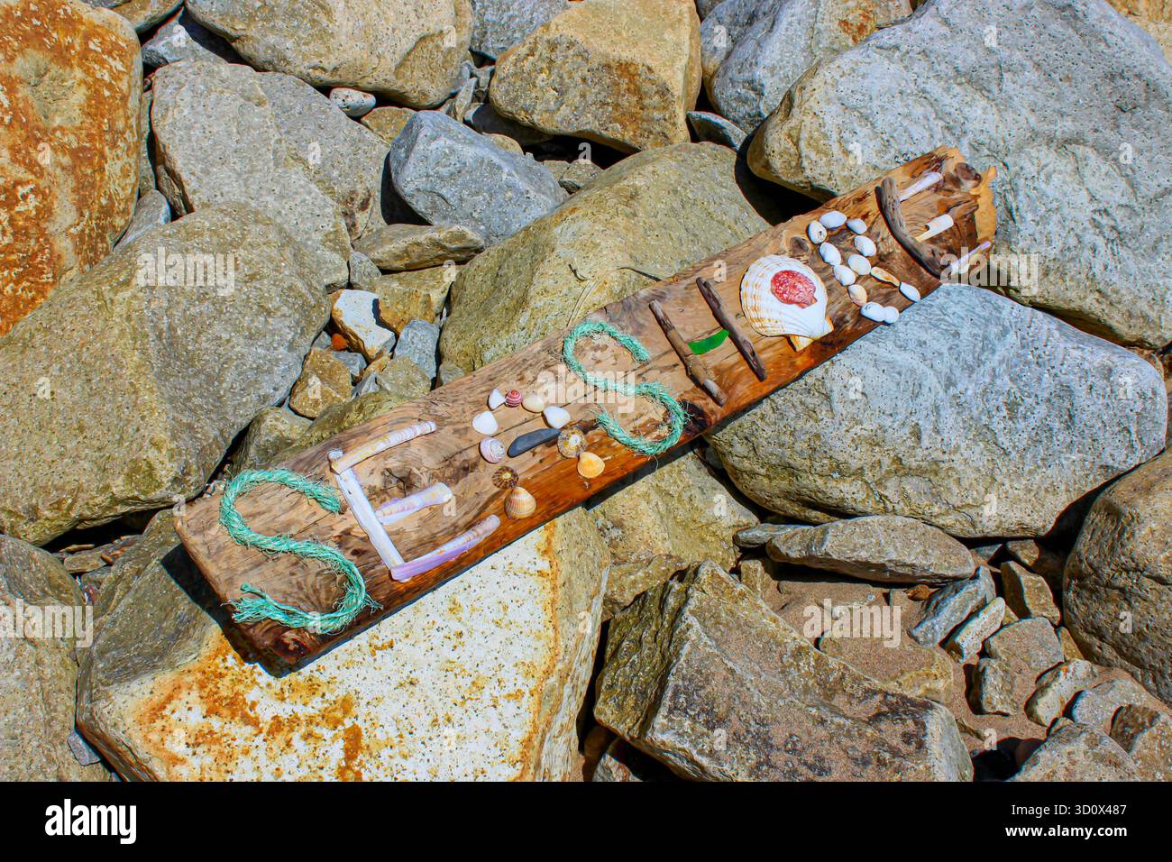 rustic seashore sign on a beach Stock Photo - Alamy