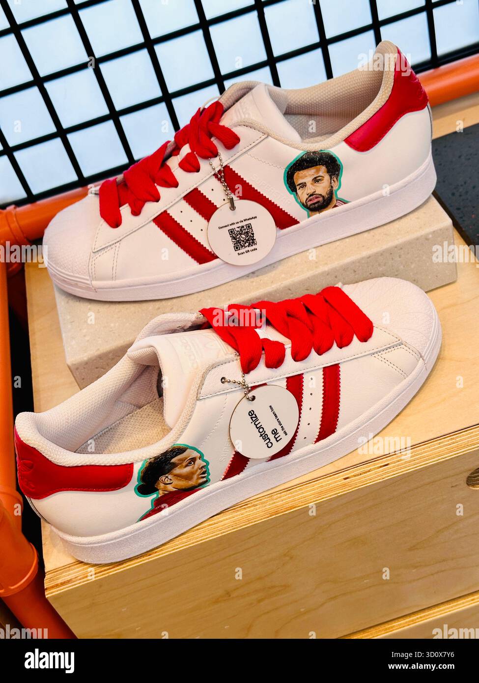 Liverpool FC custom Adidas trainers - Smartphone Captured Stock Image