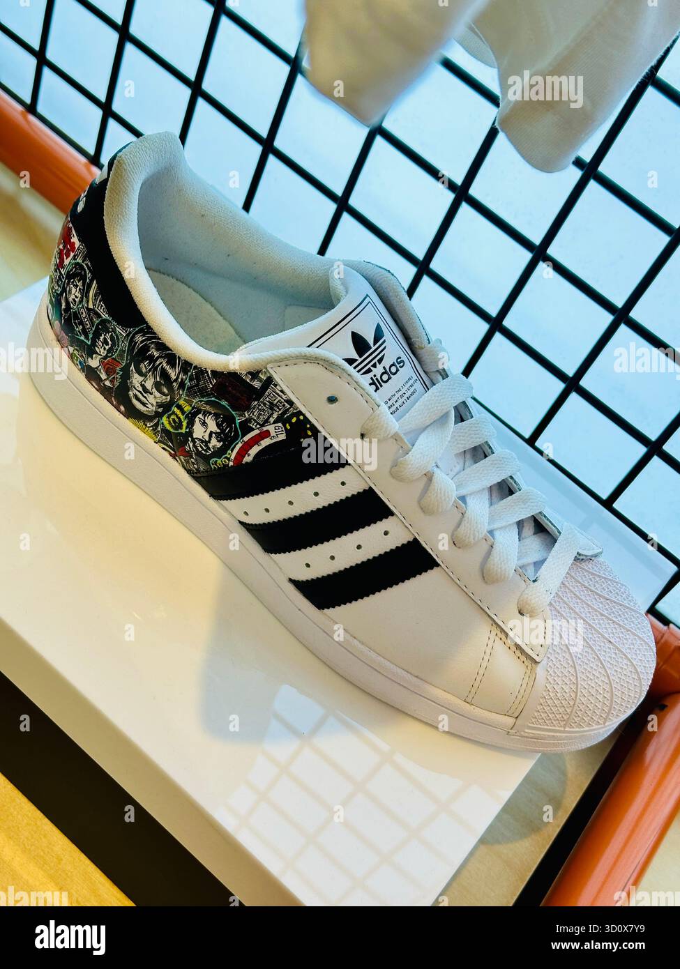 Oasis custom Adidas trainers - Smartphone Captured Stock Image