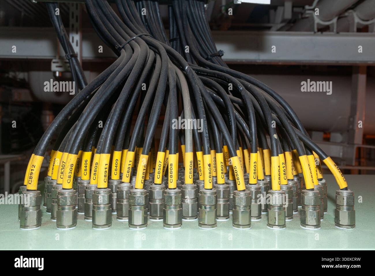 Several powerful electrical cables connected to a junction box Stock Photo
