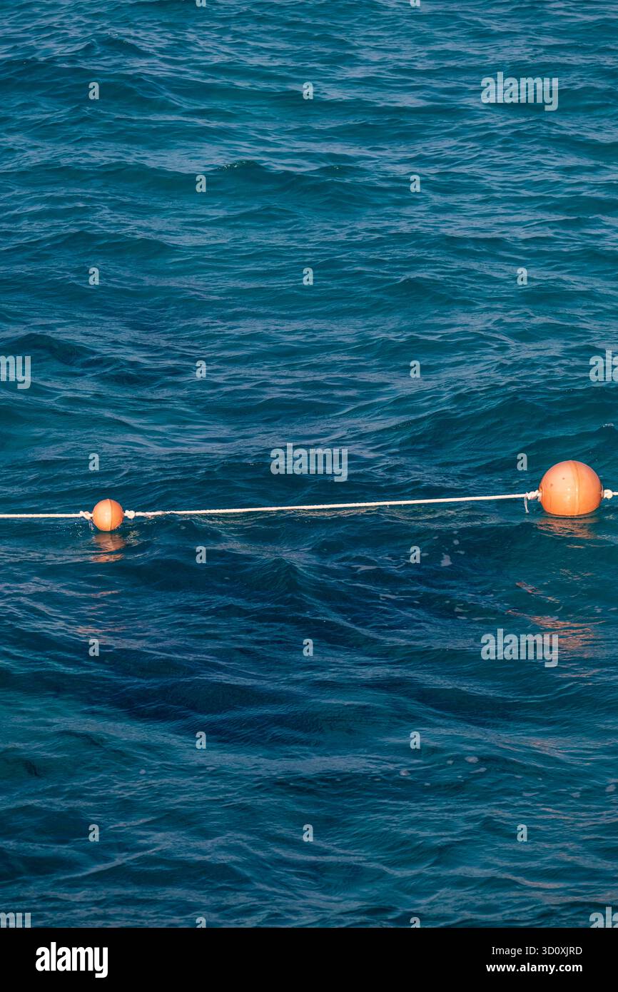 Lifebuoys in the blue water of the Mediterranean, North Coast, Egypt Stock Photo