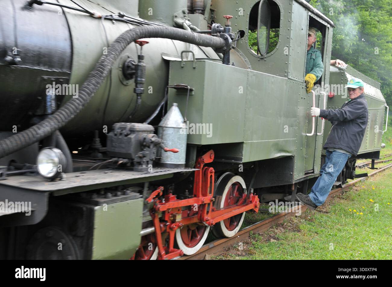 Crew members working on a steam locomotive of the Bieszczady Forest ...