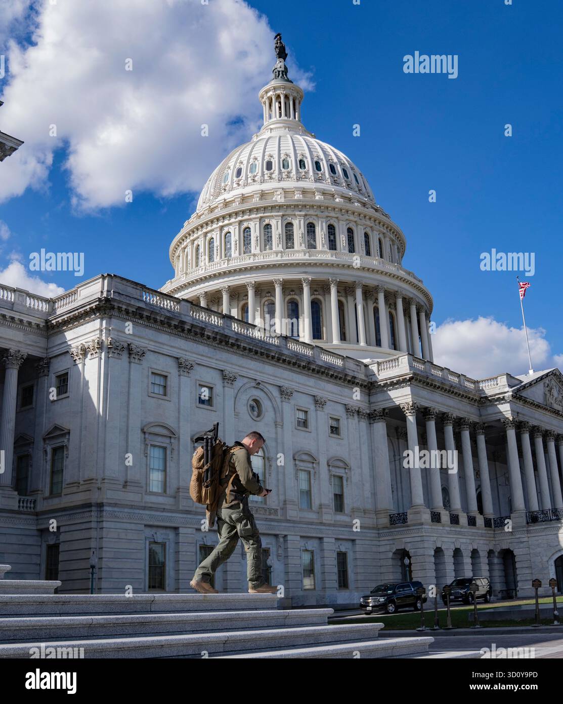 A United States Capitol Police (USCP) counter sniper officer walks down ...