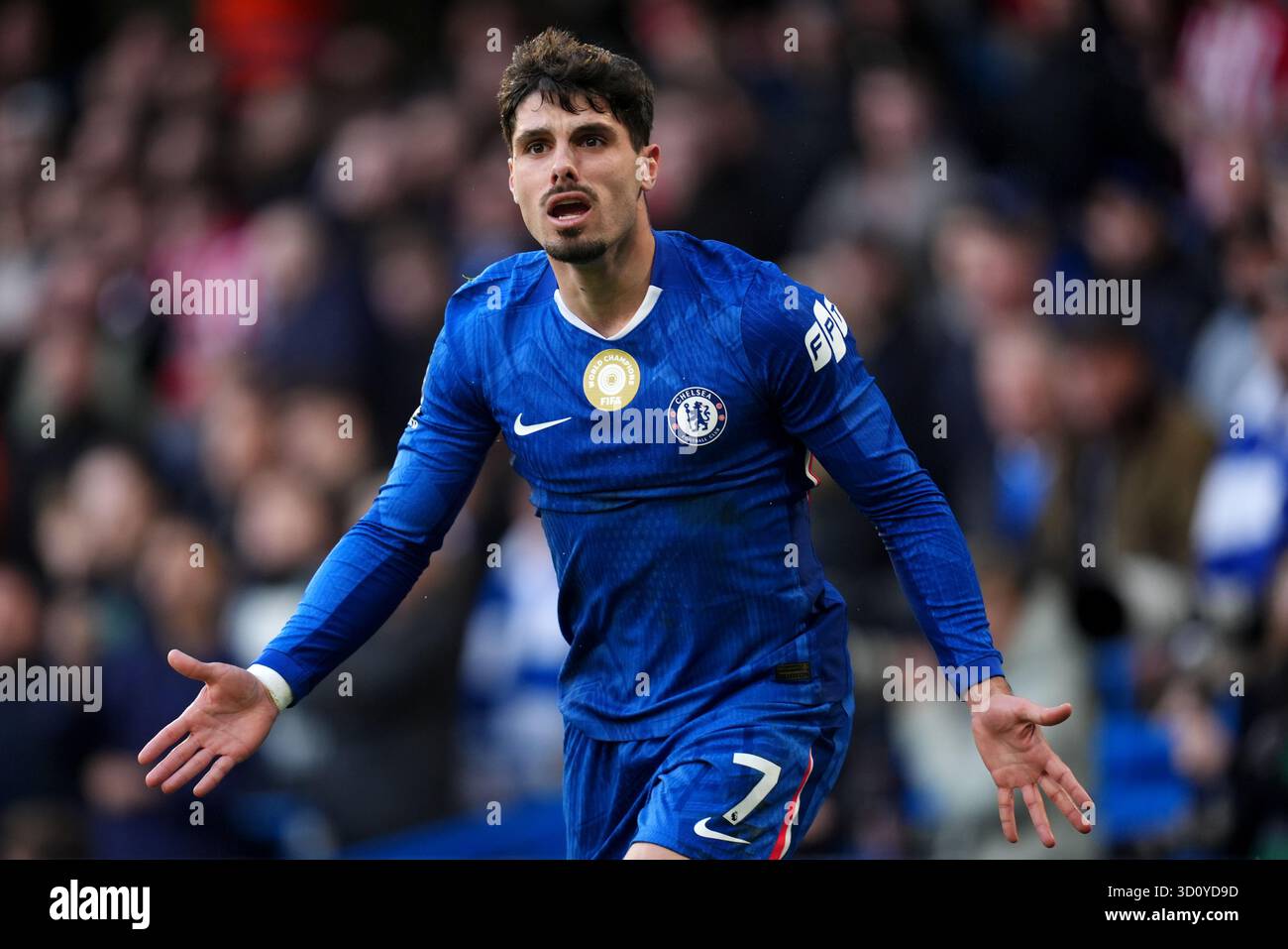Chelsea's Pedro Neto reacts after a challenge on him during the Premier ...