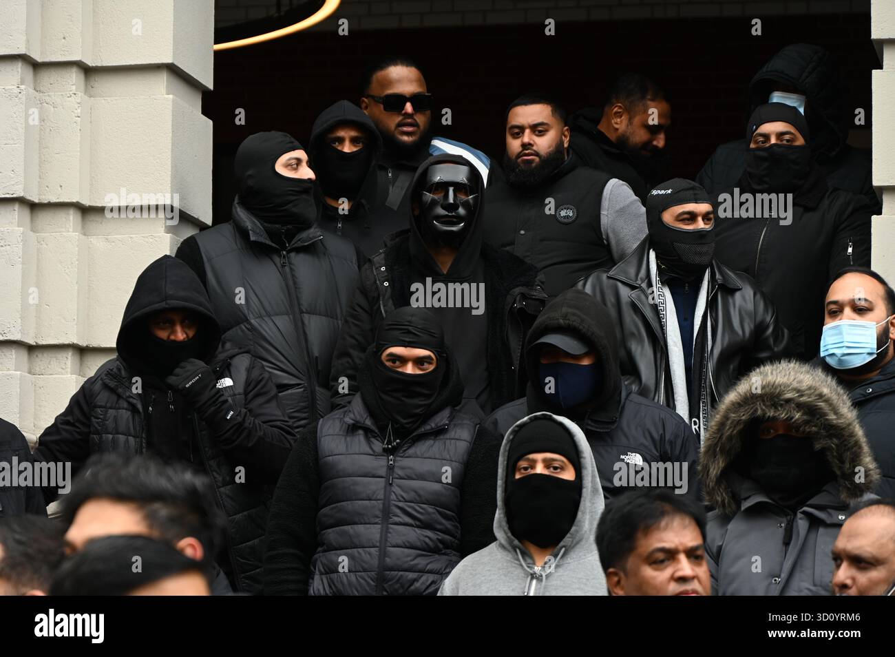Masks Joined London, England, 25 October 2025: A group of youth wearing mask joined ...