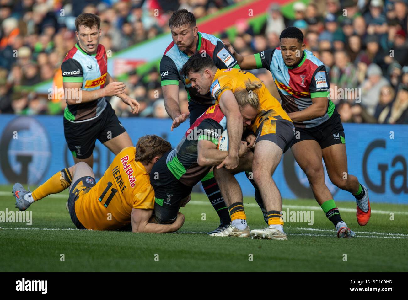 Tyrone Green (15 Harlequins) is double tackled by Alex Hearle (11 ...
