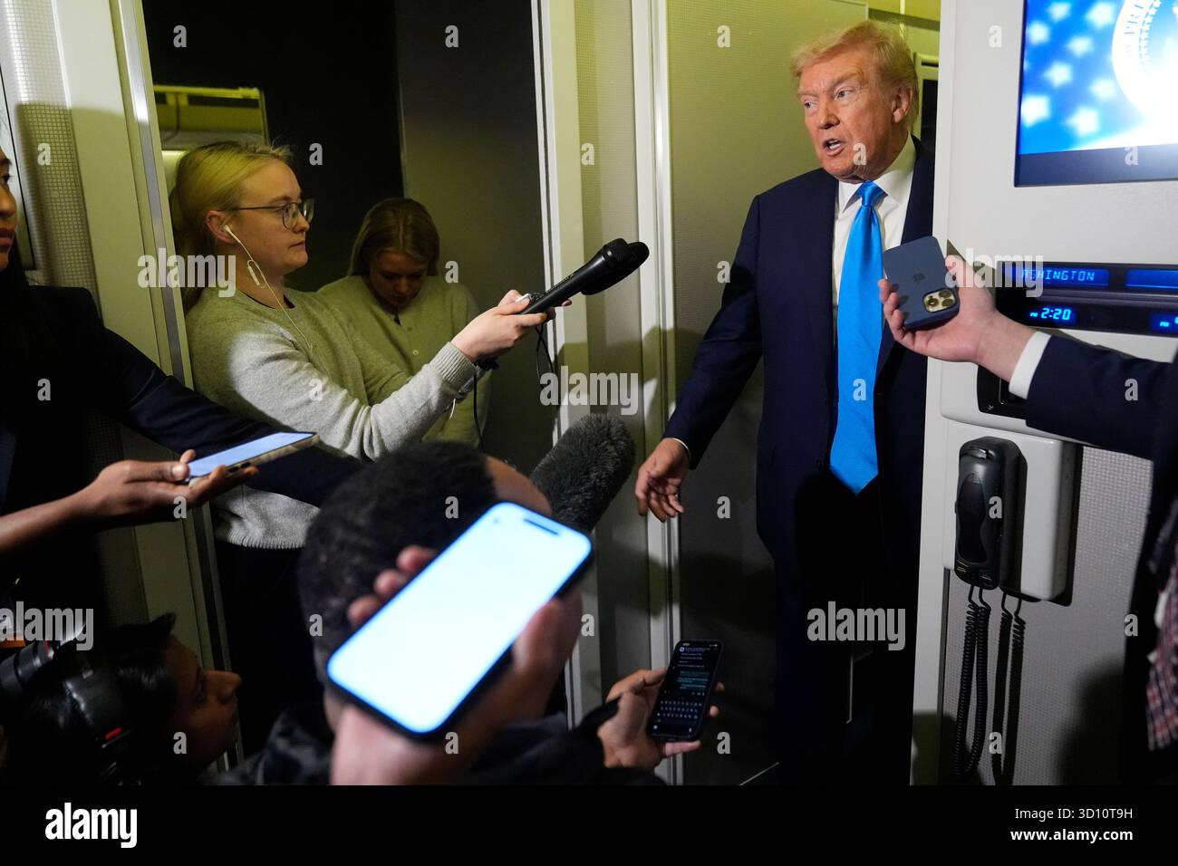 President Donald Trump speaks with reporters aboard Air Force One at Al ...