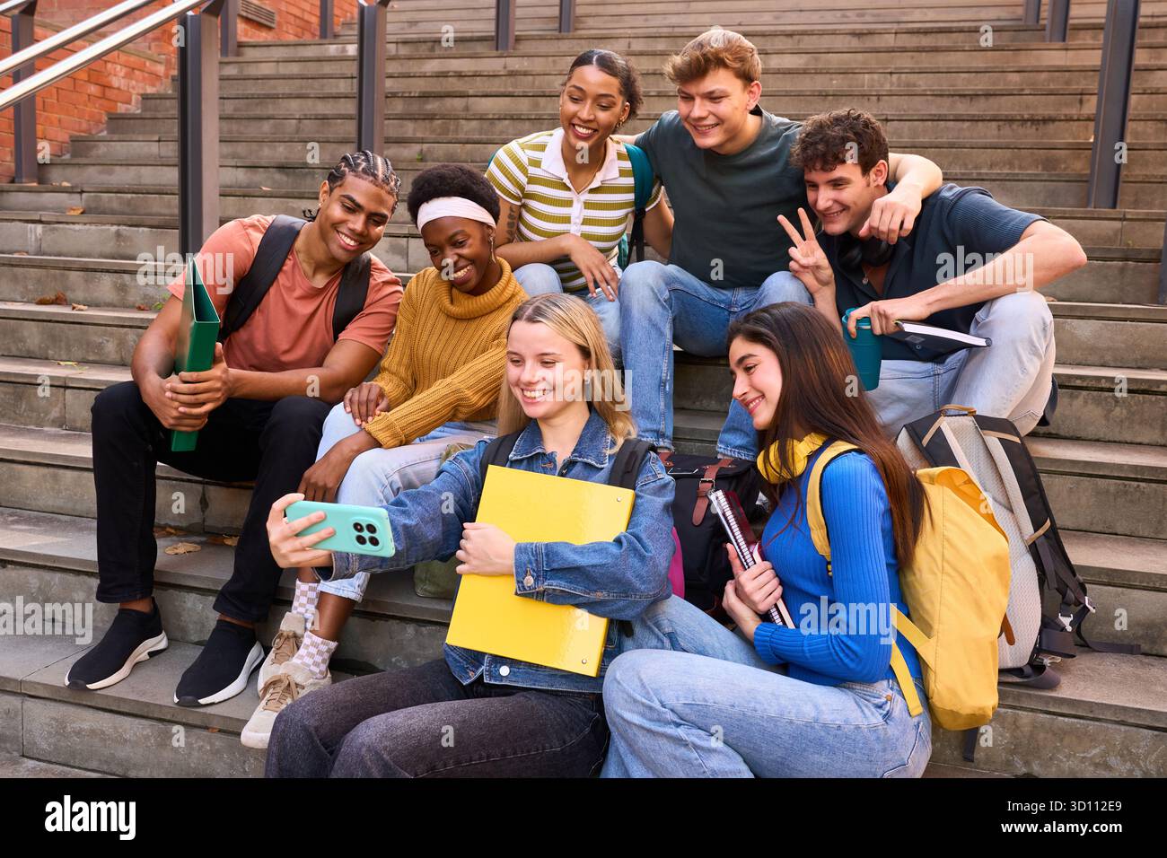 Group of diverse university students taking a joyful selfie Stock Photo