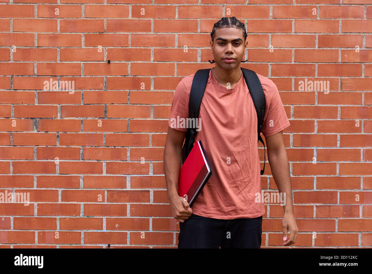 Young college student with backpack and notebook Stock Photo