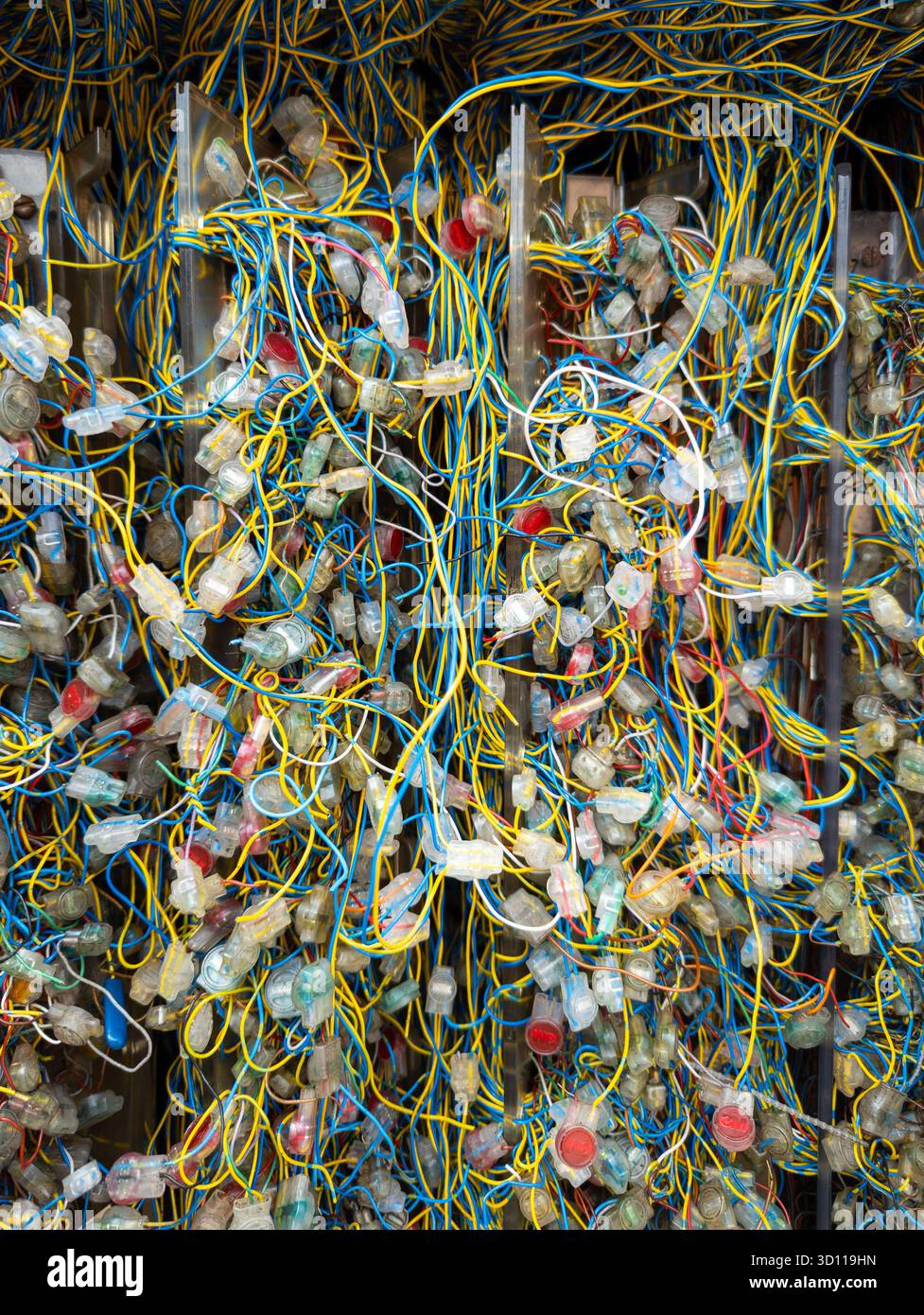 Tangle of colour coded wires and cables which are broadband primary connection points, England, UK Stock Photo