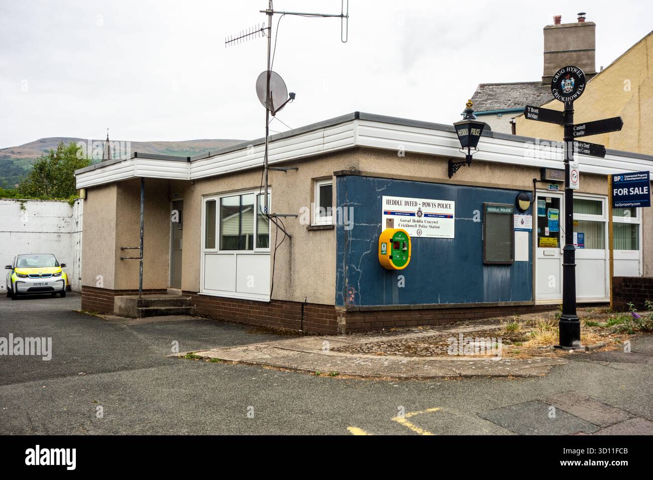 Police station Heddlu with defibrillator on the wall  for sale in the Welsh market town of Crickhowell Powys Wales Stock Photo