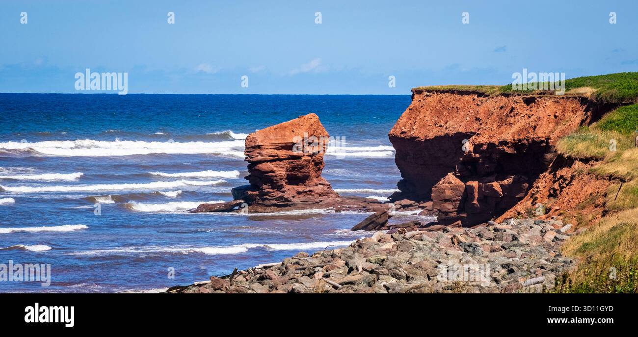 Rugged red cliff coast in Prince Edward Island National Park on the ...