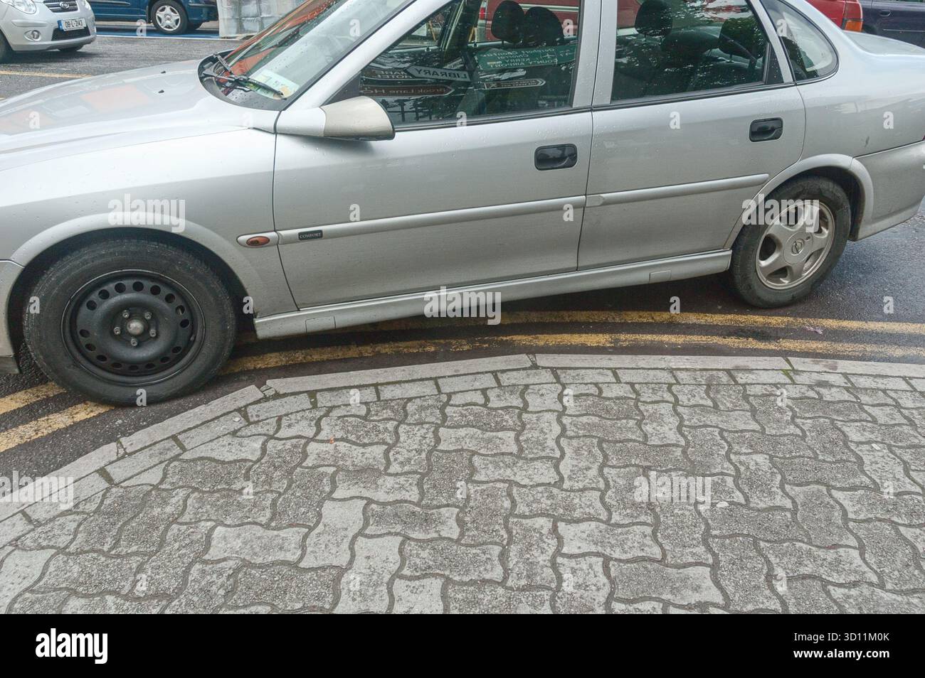 A car parked on double yellow lines at The Square, Kenmare, Co. Kerry, Ireland Stock Photo