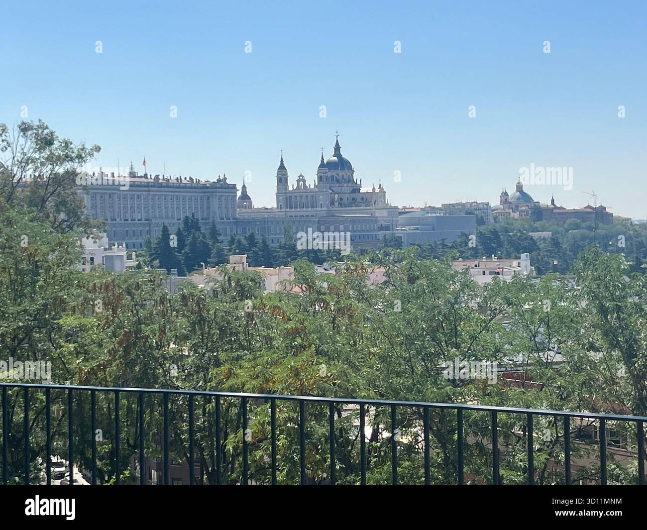 Closer view of the Royal Palace and Almudena Cathedral in Madrid, captured from the Templo de Debod viewpoint with clear summer light. - Smartphone Captured Stock Image