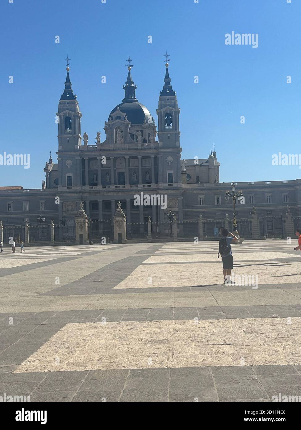 Almudena Cathedral in Madrid, Spain, viewed from Plaza de la Armería on a sunny summer day. - Smartphone Captured Stock Image