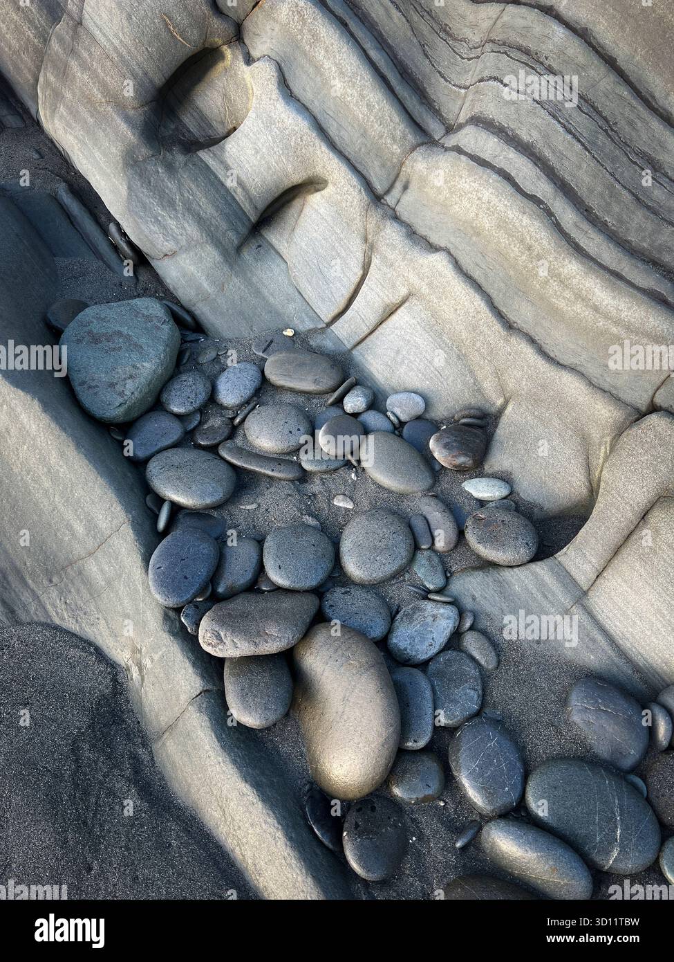 Rocks, sand, and siltstone at Beach 4 in Olympic National Park, Washington, USA. - Smartphone Captured Stock Image