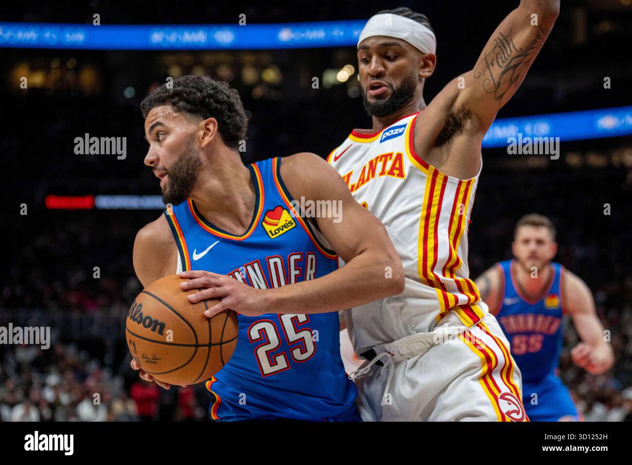 Oklahoma City Thunder Guard Ajay Mitchell 25 Left Drives The Ball oklahoma-city-thunder-guard-ajay-mitchell-25-left-drives-the-ball