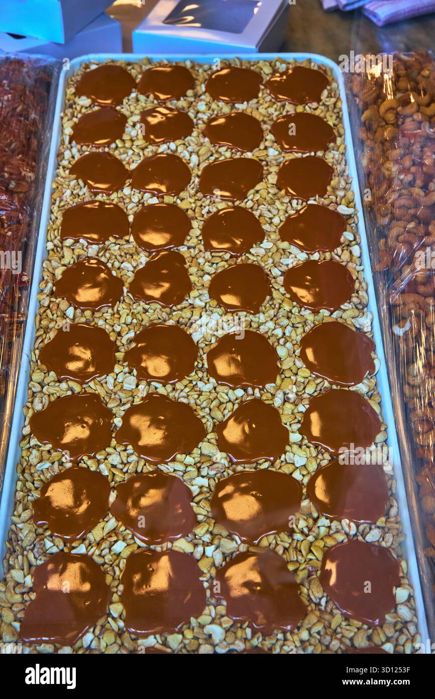 Chocolate Nut Clusters on Tray Gourmet Confectionery Display with Nuts Stock Photo