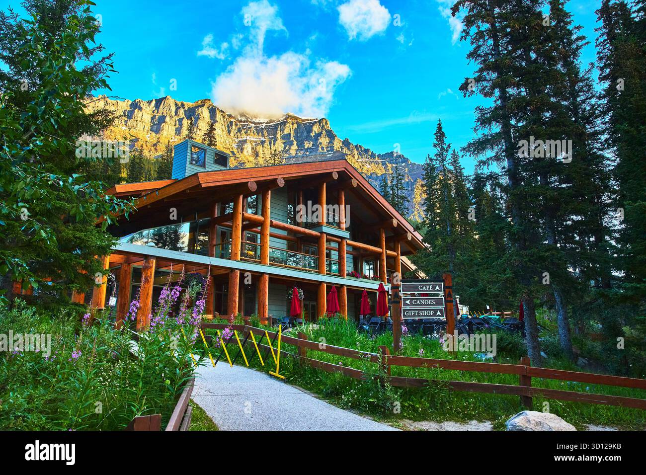 Mountain Lodge Retreat With Pine Forest And Golden Hour Peaks Stock Photo