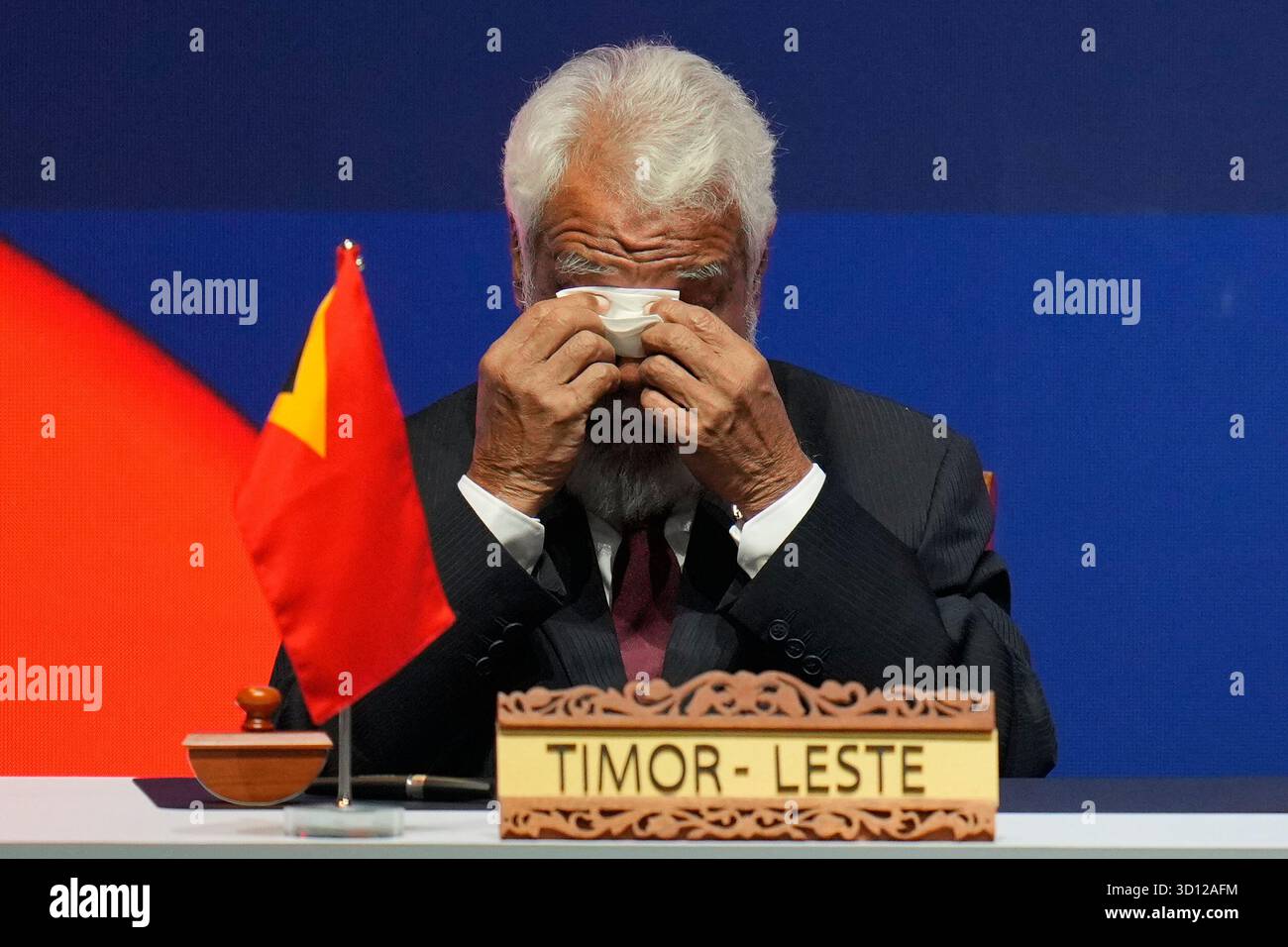 East Timor's Prime Minister Kay Rala Xanana Gusmao wipes his eyes ...