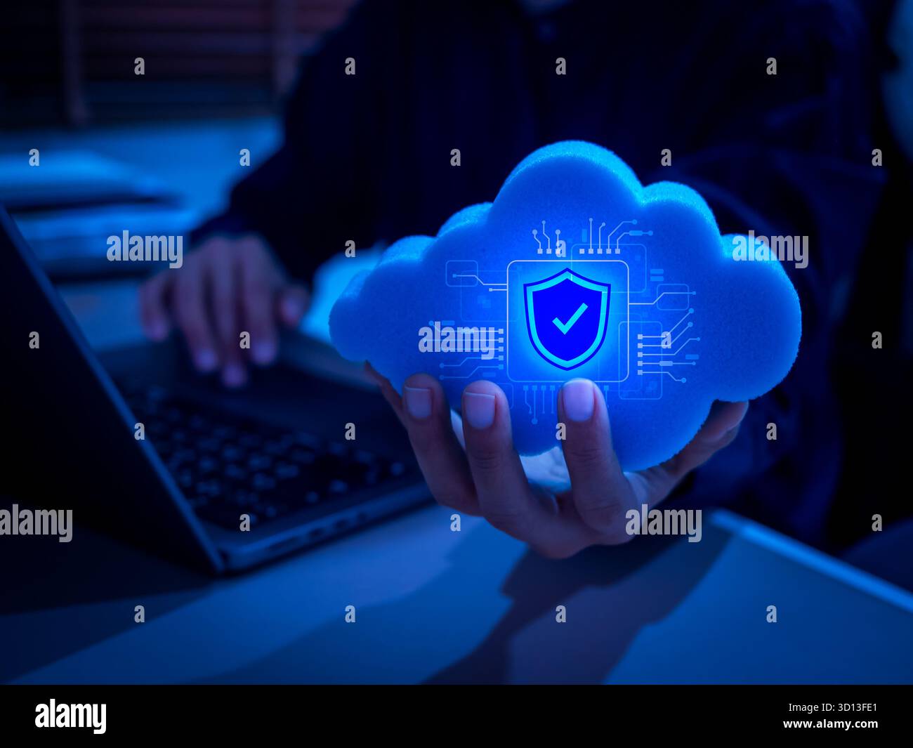 AI-powered cloud computing concept with digital security shield icon in hand. Representing cybersecurity, cloud data protection, artificial intelligen Stock Photo