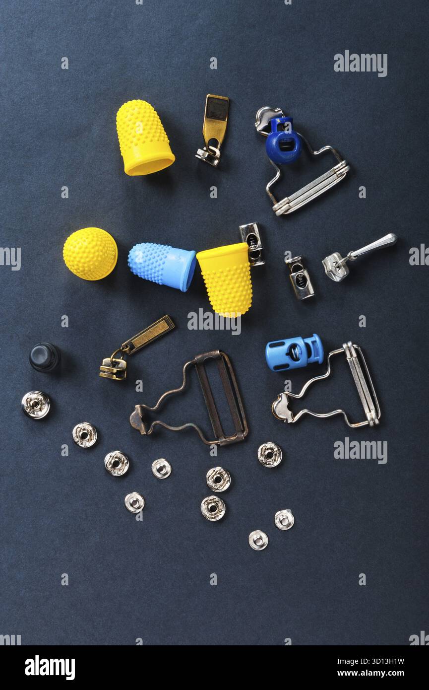 Thimble and sewing pins on dark backdround Stock Photo