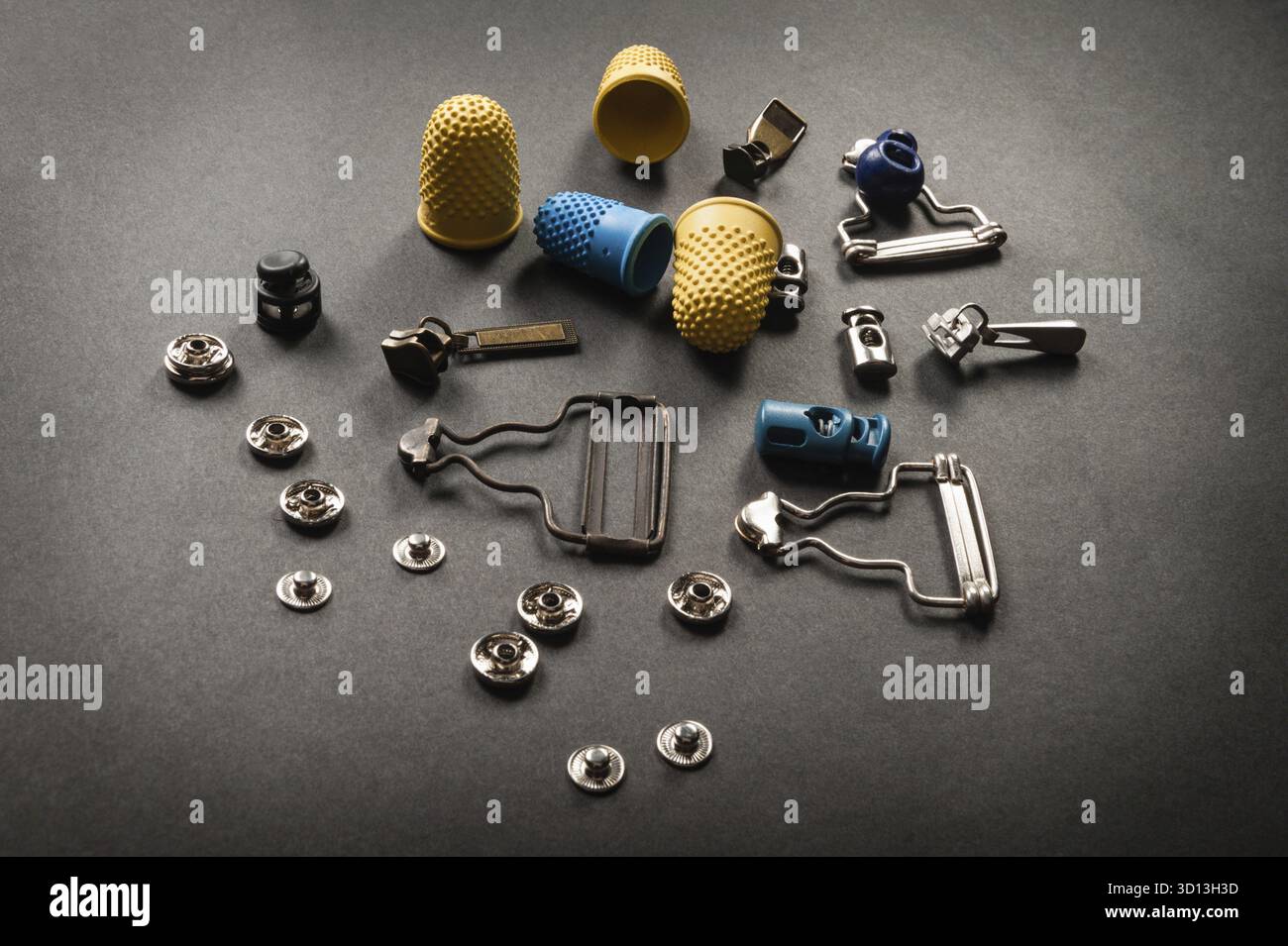 Thimble and sewing pins on dark backdround Stock Photo
