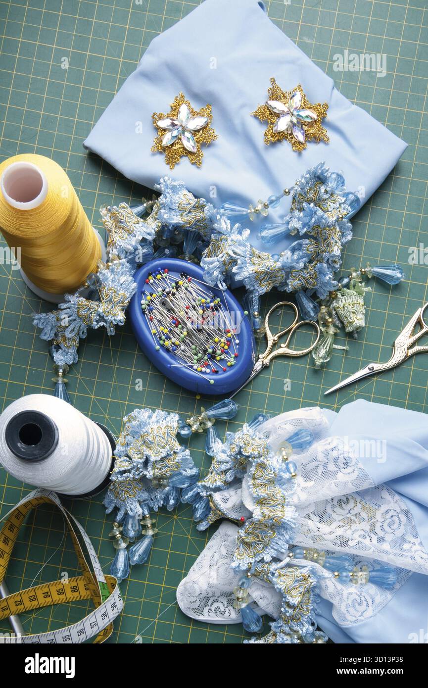 Set for handiwork: Scissors, thread, pins, centimeter, needles, ornaments Stock Photo