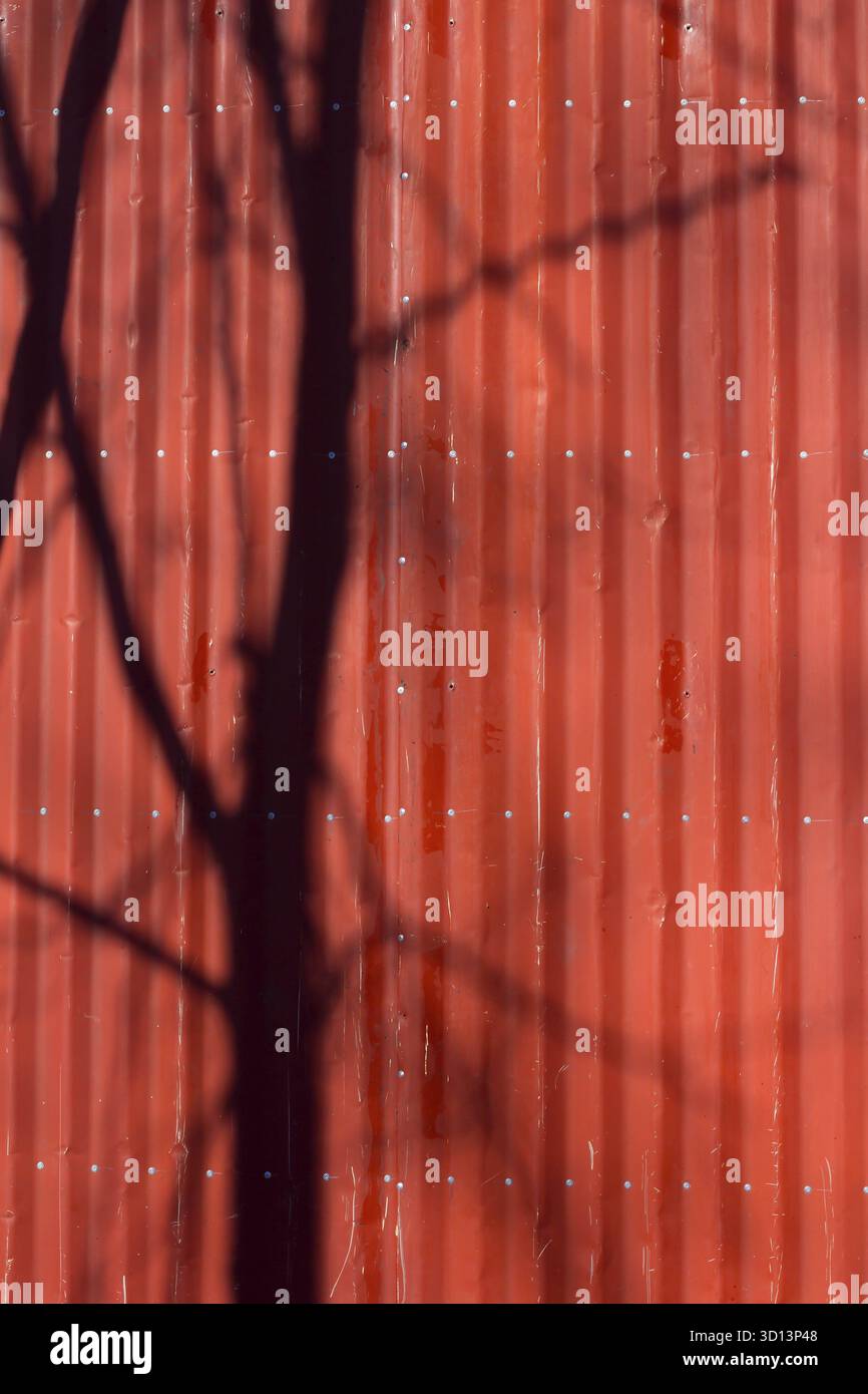 Red metal tile texture. The texture is red. Red wall Stock Photo