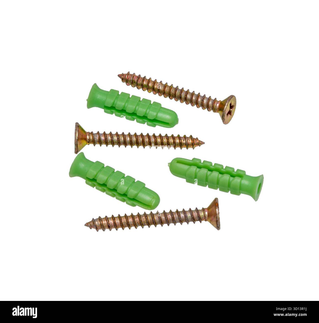 Screws and plastic dowels on white background. Stock Photo