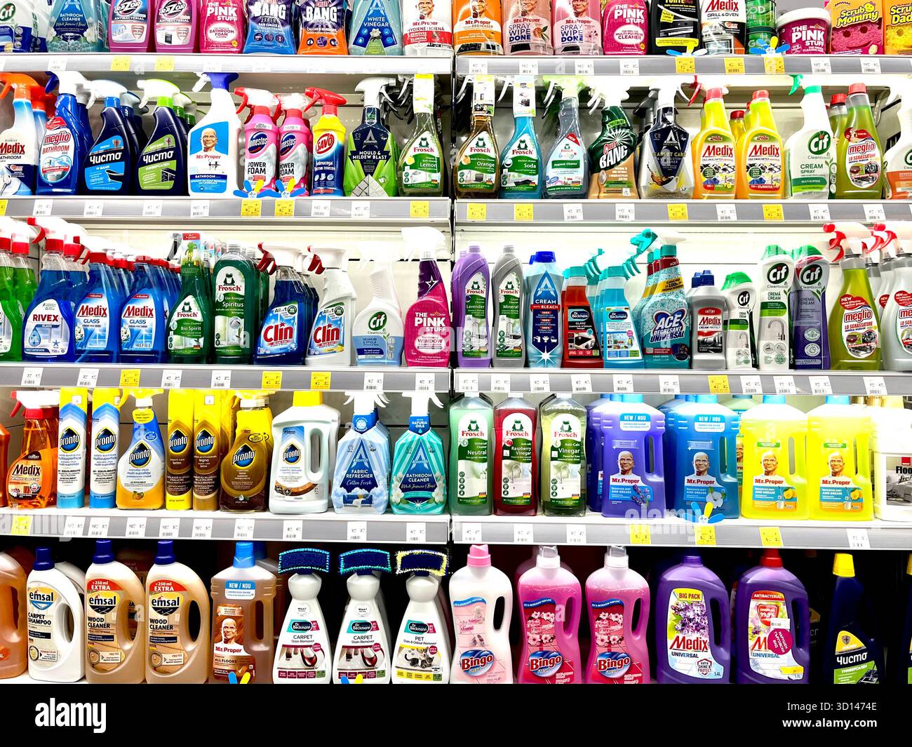 Store shelves display filled with a variety of home cleaning products, sprays, and bottles - Smartphone Captured Stock Image