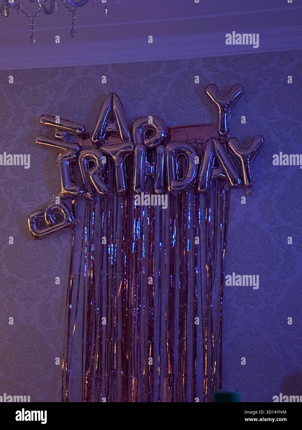 happy birthday sign after party on the wall - Smartphone Captured Stock Image