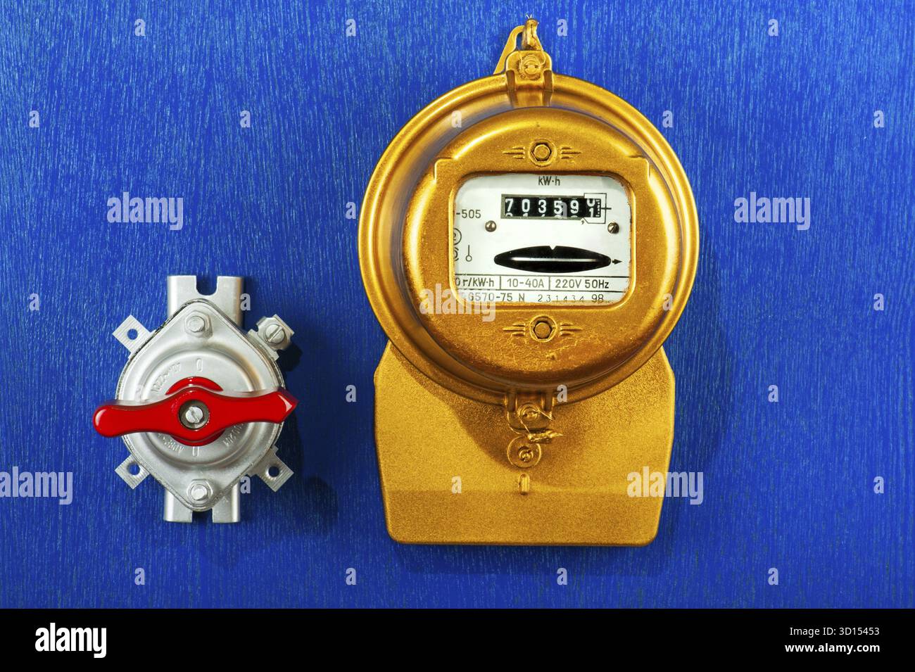 Golden retro electric meter with toggle switch Stock Photo - Alamy