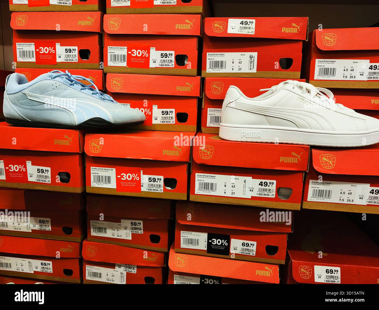 Puma shop interior sneakers display hi-res stock photography and