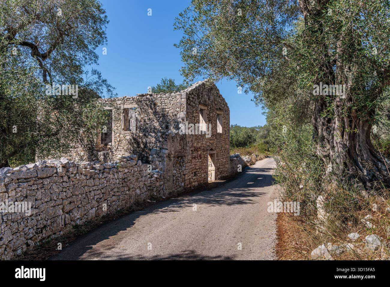 An abandoned house on one of the roads on the island of Paxos, Greece ...